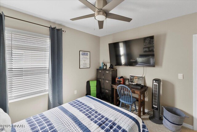 2714 Neverland Dr, New Smyrna Beach, FL 32168 - carpeted bedroom with baseboards and ceiling fan