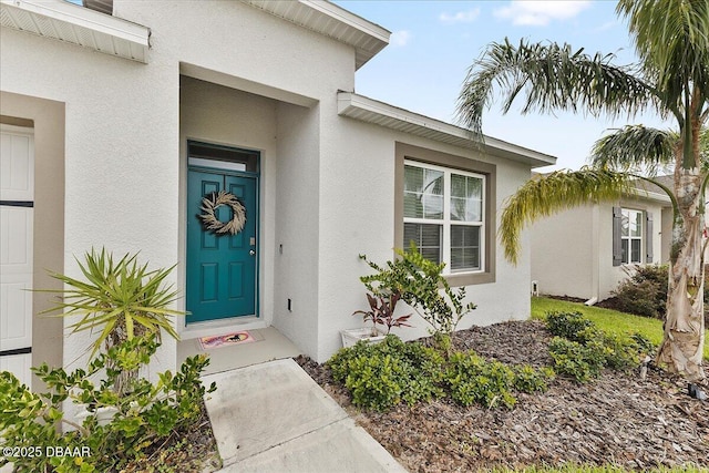 2714 Neverland Dr, New Smyrna Beach, FL 32168 - doorway to property with stucco siding