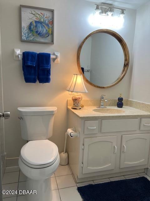 4175 S Atlantic Ave Unit 1240, New Smyrna Beach, FL 32169 - bathroom with toilet, vanity, and tile patterned flooring