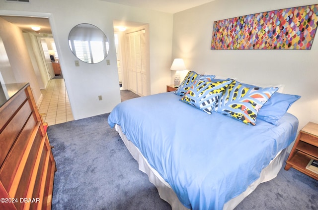 4175 S Atlantic Ave Unit 1240, New Smyrna Beach, FL 32169 - bedroom with dark colored carpet and a closet