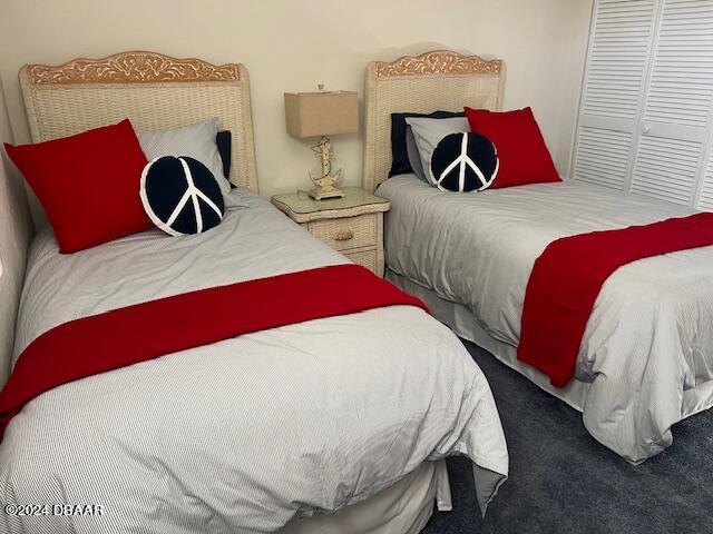 4175 S Atlantic Ave Unit 1240, New Smyrna Beach, FL 32169 - carpeted bedroom featuring a closet