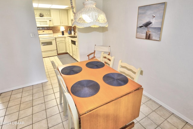 4175 S Atlantic Ave Unit 1240, New Smyrna Beach, FL 32169 - tiled dining area with a notable chandelier