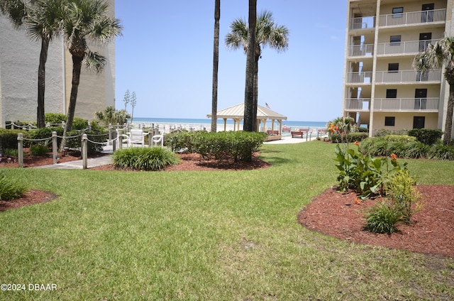 4175 S Atlantic Ave Unit 1240, New Smyrna Beach, FL 32169 - exterior space featuring a lawn, a gazebo, and a water view