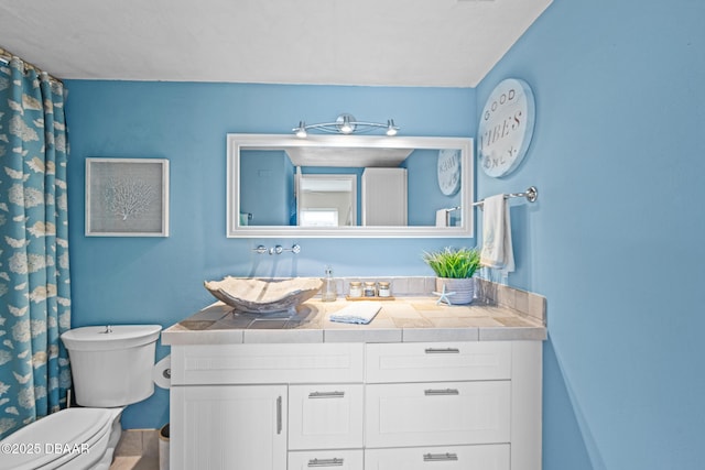 bathroom featuring vanity and toilet