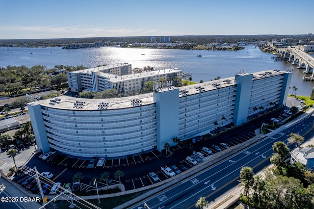 birds eye view of property with a water view