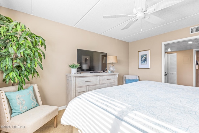 carpeted bedroom with ceiling fan