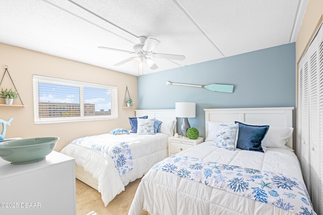 bedroom with light carpet, a closet, and ceiling fan