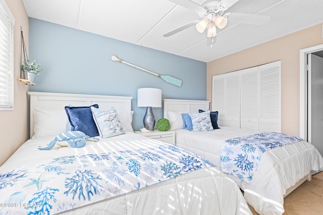 bedroom featuring carpet, a closet, and ceiling fan