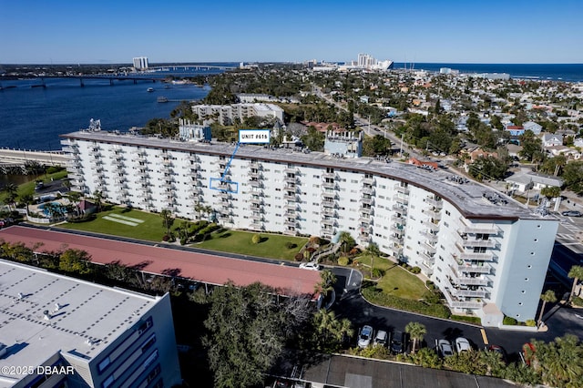 birds eye view of property with a water view