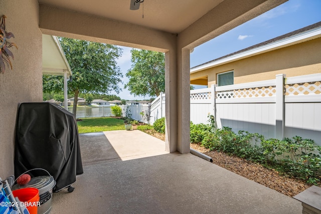 1748 Savannah Ln, Port Orange, FL 32128 - view of patio / terrace with a fenced backyard, ceiling fan, and grilling area