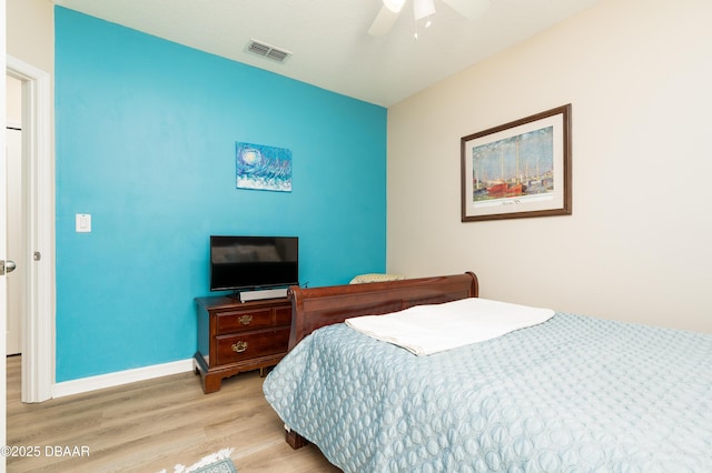 1748 Savannah Ln, Port Orange, FL 32128 - bedroom with wood finished floors, baseboards, and a ceiling fan