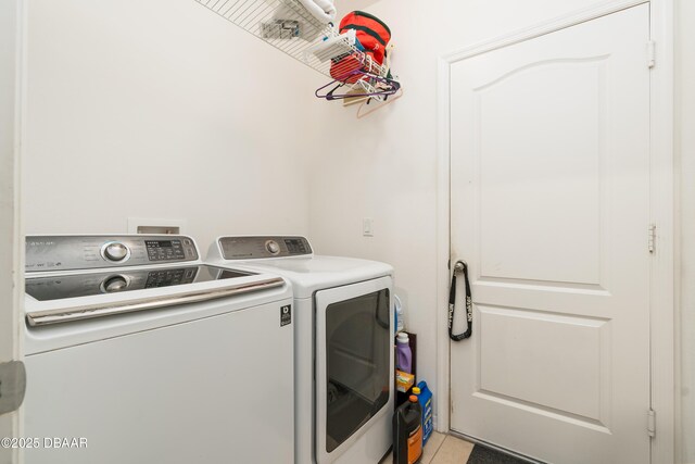 1748 Savannah Ln, Port Orange, FL 32128 - washroom featuring independent washer and dryer and light tile patterned floors