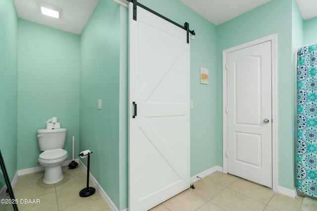 1748 Savannah Ln, Port Orange, FL 32128 - bathroom featuring tile patterned flooring, toilet, and baseboards