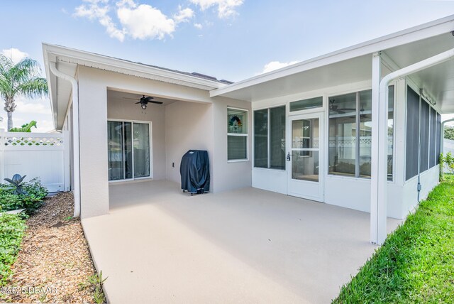 1748 Savannah Ln, Port Orange, FL 32128 - view of patio / terrace featuring fence, a sunroom, and a ceiling fan