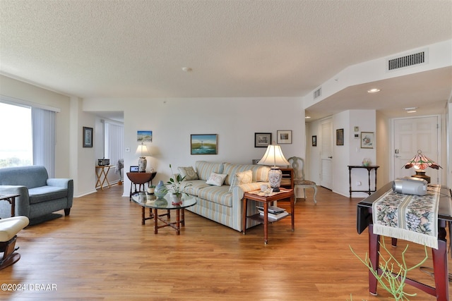 3 Oceans W Blvd Unit 5C4, Daytona Beach Shores, FL 32118 - living area featuring a textured ceiling, light wood finished floors, and recessed lighting