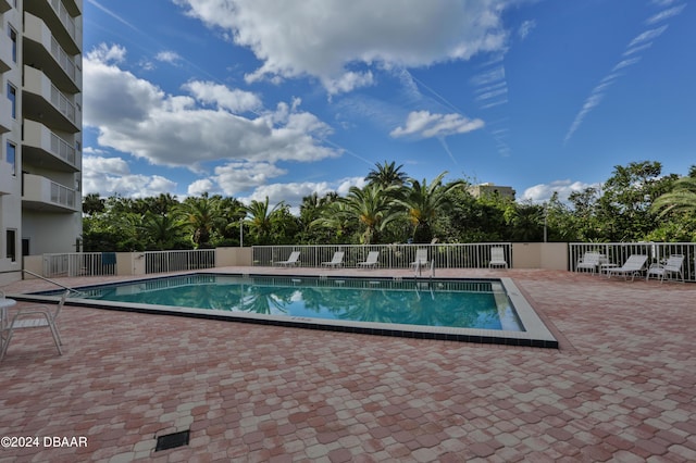 3 Oceans W Blvd Unit 5C4, Daytona Beach Shores, FL 32118 - community pool featuring fence and a patio area