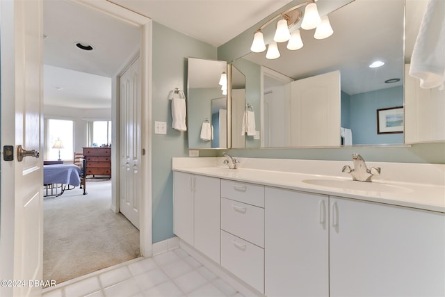 3 Oceans W Blvd Unit 5C4, Daytona Beach Shores, FL 32118 - ensuite bathroom with double vanity, baseboards, and recessed lighting