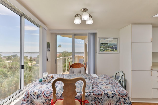 3 Oceans W Blvd Unit 5C4, Daytona Beach Shores, FL 32118 - dining room featuring a chandelier