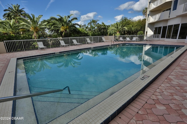 3 Oceans W Blvd Unit 5C4, Daytona Beach Shores, FL 32118 - community pool with fence and a patio