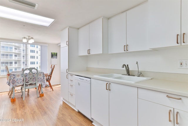 kitchen with dishwasher, sink, light hardwood / wood-style floors, and white cabinets