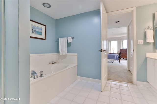 bathroom with vanity and a tub