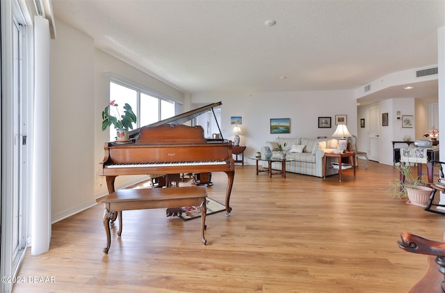 3 Oceans W Blvd Unit 5C4, Daytona Beach Shores, FL 32118 - living area featuring light wood-style floors and a textured ceiling