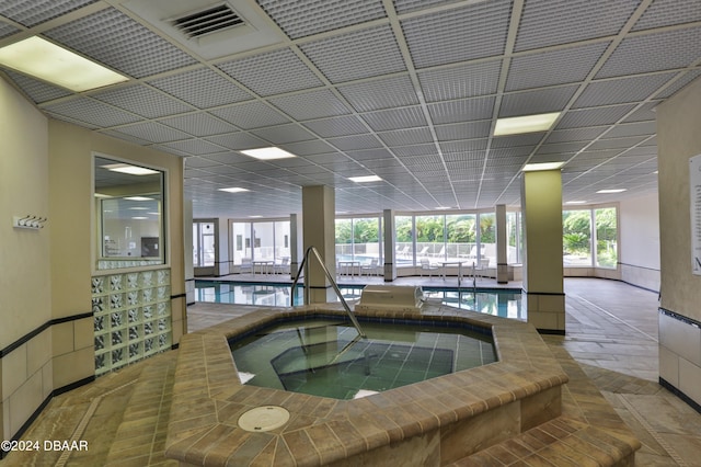 view of pool with an indoor hot tub