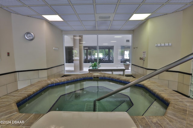 view of swimming pool featuring an indoor in ground hot tub