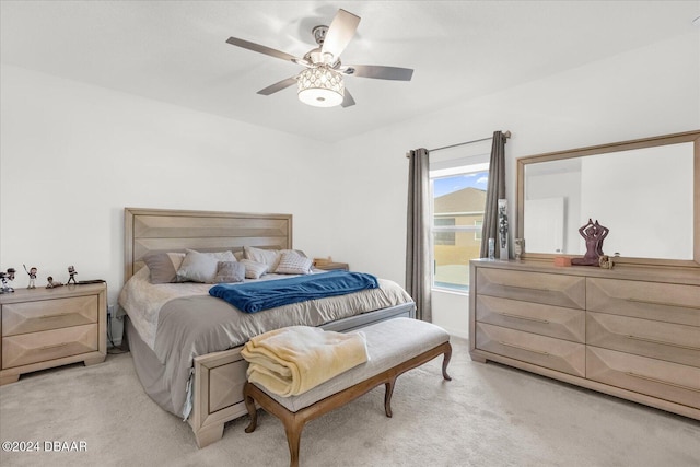 bedroom with ceiling fan and light colored carpet