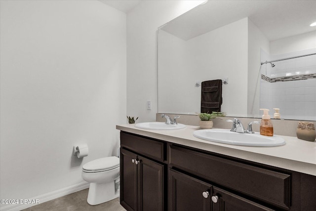 bathroom featuring walk in shower, vanity, and toilet