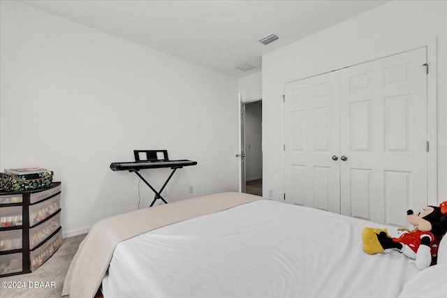 carpeted bedroom featuring a closet