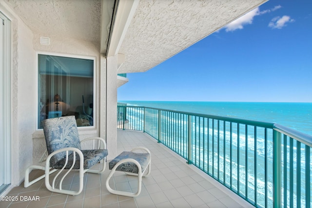 balcony featuring a water view