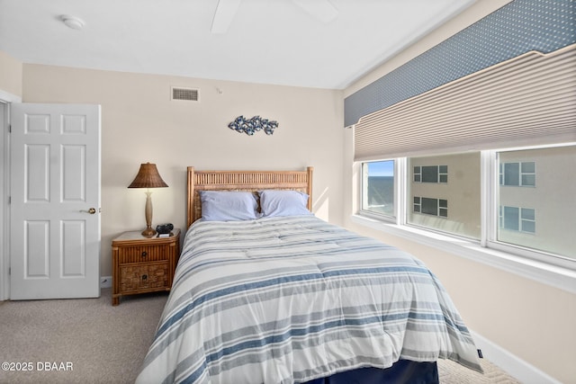 bedroom with light colored carpet and ceiling fan