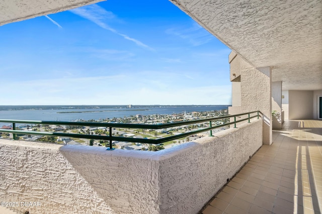 balcony featuring a water view