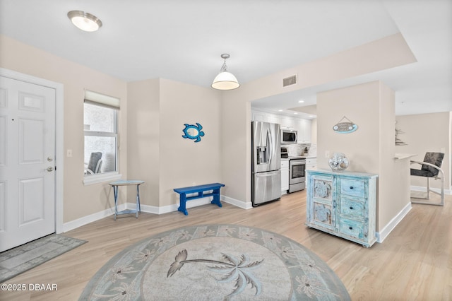 foyer featuring light wood-type flooring