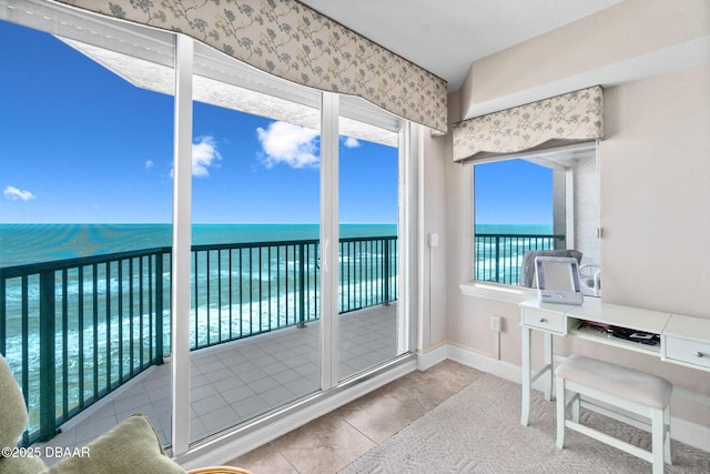 sunroom with a water view