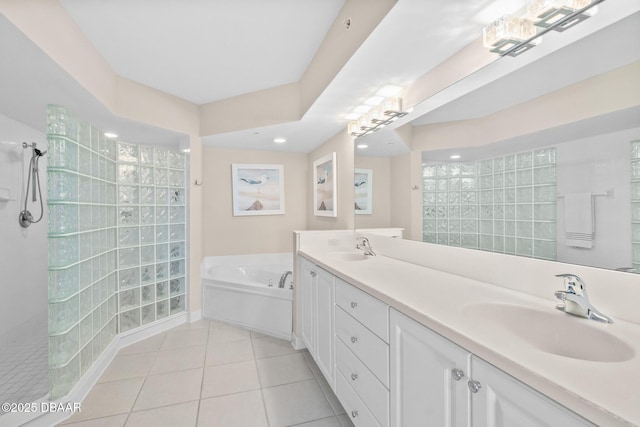 bathroom with vanity, shower with separate bathtub, and tile patterned flooring