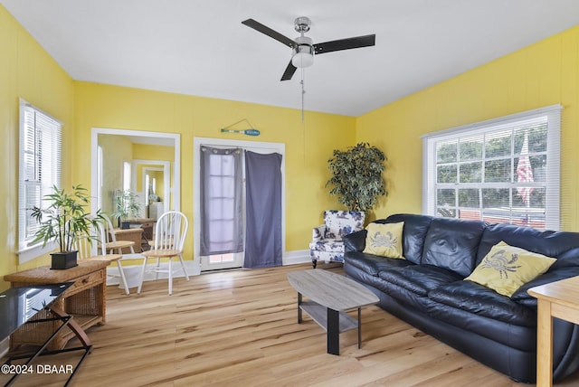 living area featuring light wood finished floors and a ceiling fan