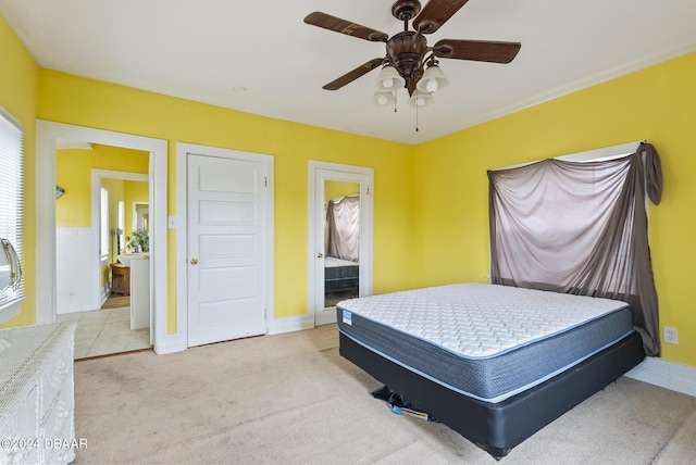 bedroom featuring carpet floors, baseboards, and ceiling fan