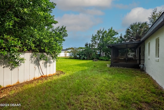 view of yard featuring a sunroom