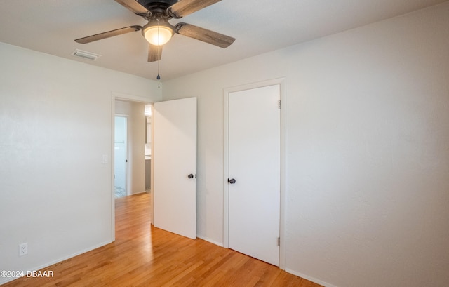 unfurnished bedroom featuring ceiling fan and light wood-type flooring