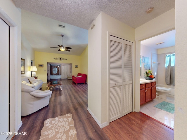 686 Middlebury Loop, New Smyrna Beach, FL 32168 - hallway featuring wood finished floors and a textured ceiling