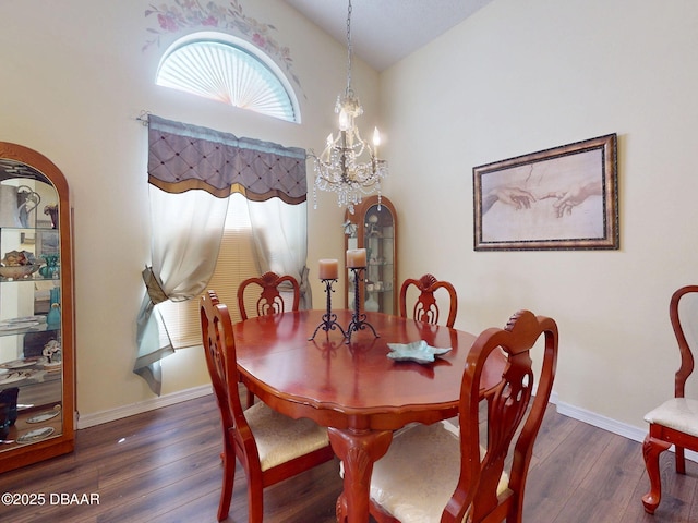 686 Middlebury Loop, New Smyrna Beach, FL 32168 - dining room with arched walkways, wood finished floors, a chandelier, baseboards, and high vaulted ceiling