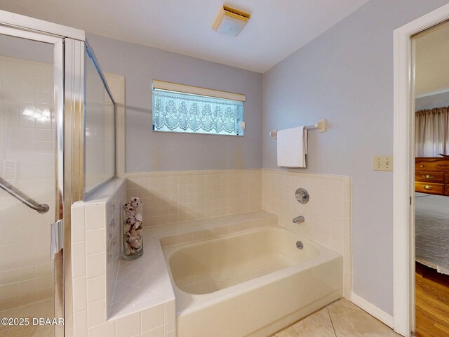 686 Middlebury Loop, New Smyrna Beach, FL 32168 - bathroom with a garden tub, tile patterned floors, and a stall shower