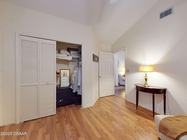 686 Middlebury Loop, New Smyrna Beach, FL 32168 - bedroom with lofted ceiling, wood finished floors, a closet, and baseboards