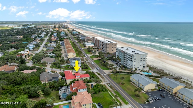 aerial view with a water view and a view of the beach