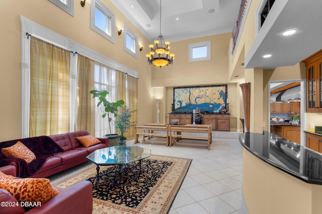 tiled living room featuring a high ceiling, an inviting chandelier, and crown molding