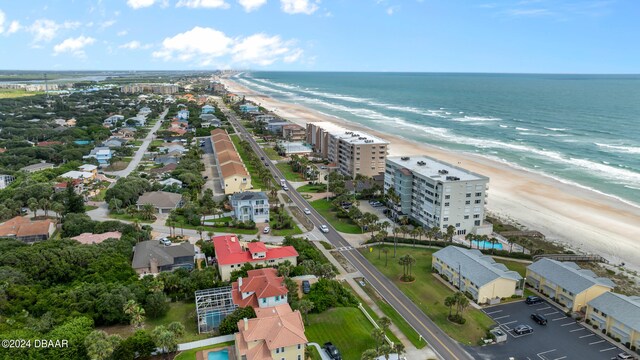 bird's eye view featuring a beach view and a water view