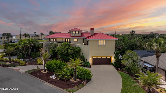 view of front of property with a garage