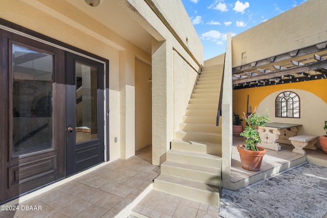 property entrance with french doors and a patio